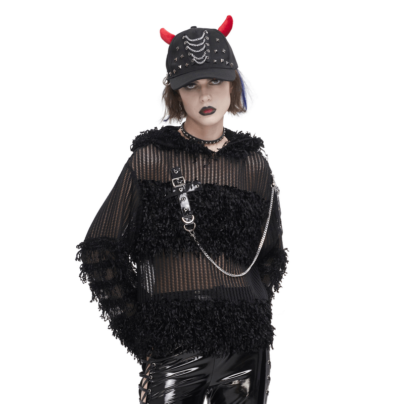 Gothic distressed sheer sweater with hood and chain, paired with a studded cap and edgy accessories.