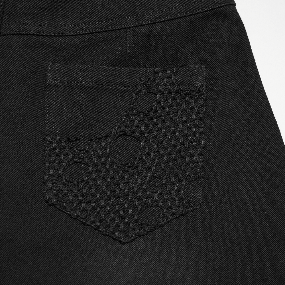Alt Tag: Gothic Distressed Studded Jeans with Mesh Paneling close-up of back pocket with textured mesh overlay and distressed cutouts