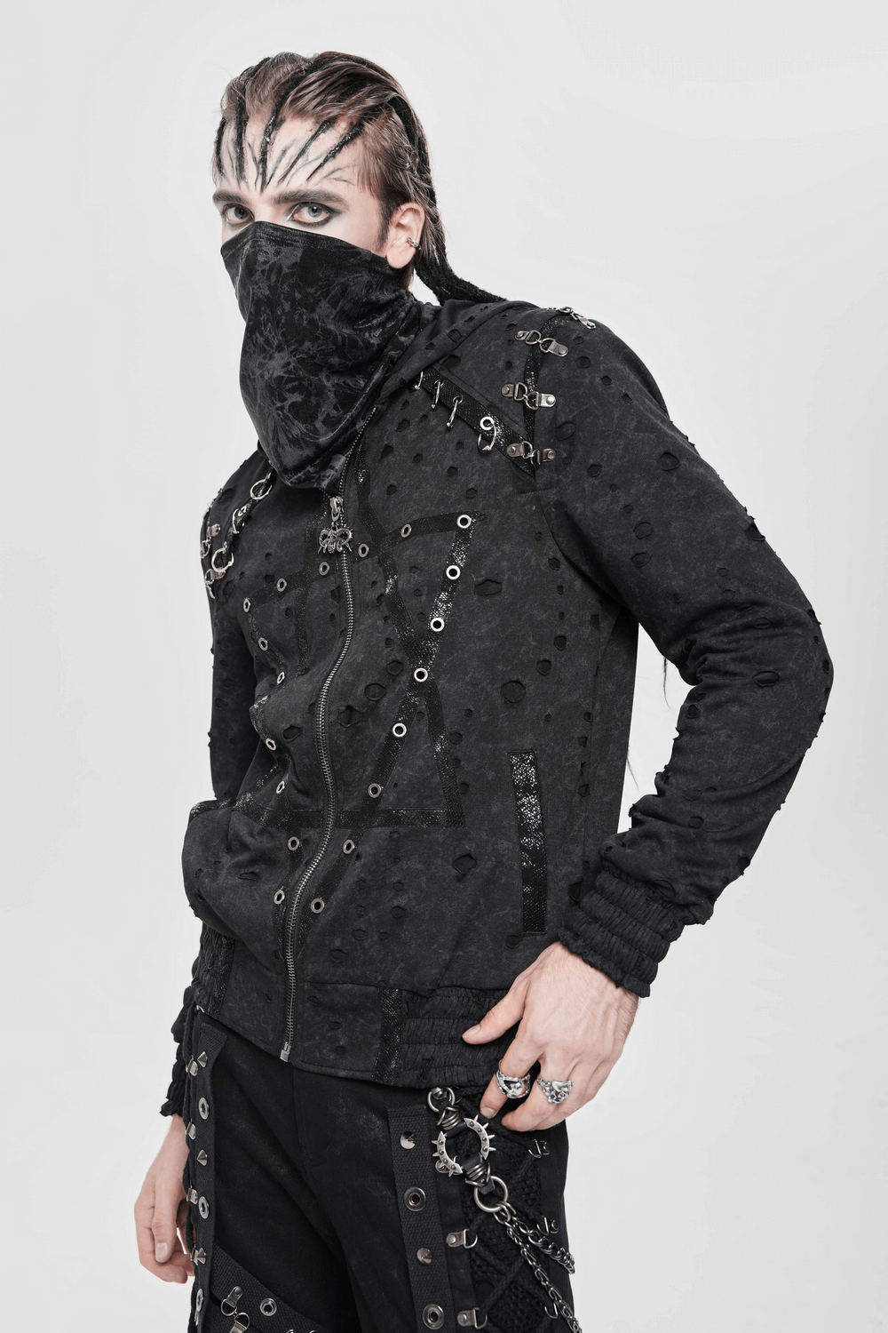Gothic Distressed Zip Jacket with Rings and Spiked Back on a model, featuring metal eyelets and punk elements.