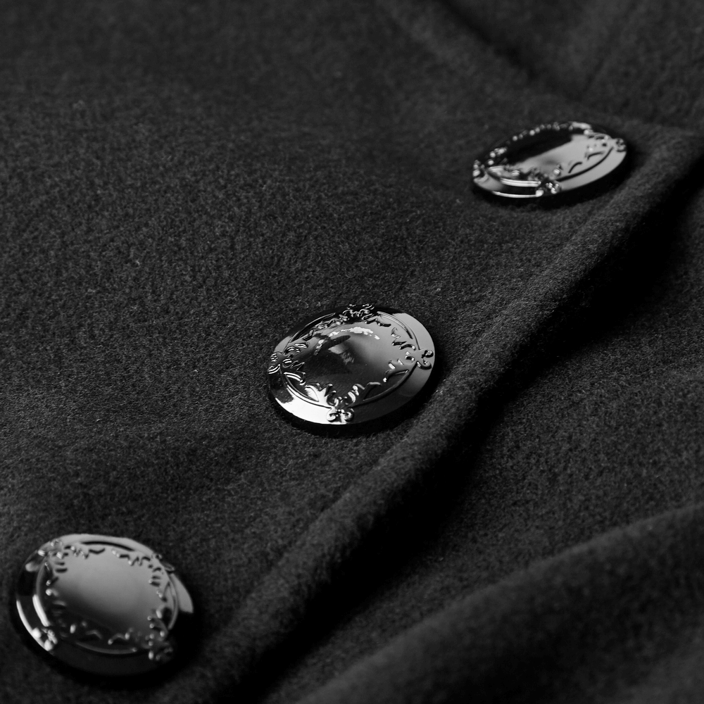 Close-up of elegant metal buttons on a gothic double-breasted coat, showcasing sleek design and detailed accents.