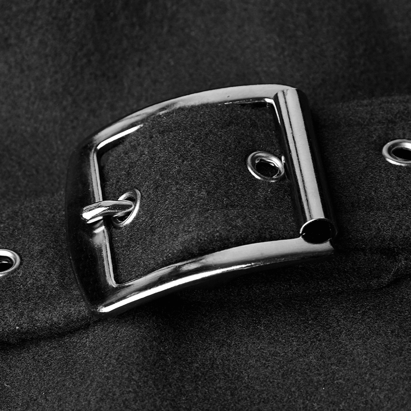 Close-up of a sleek metal buckle and strap on a gothic coat, showcasing military-inspired style and attention to detail.