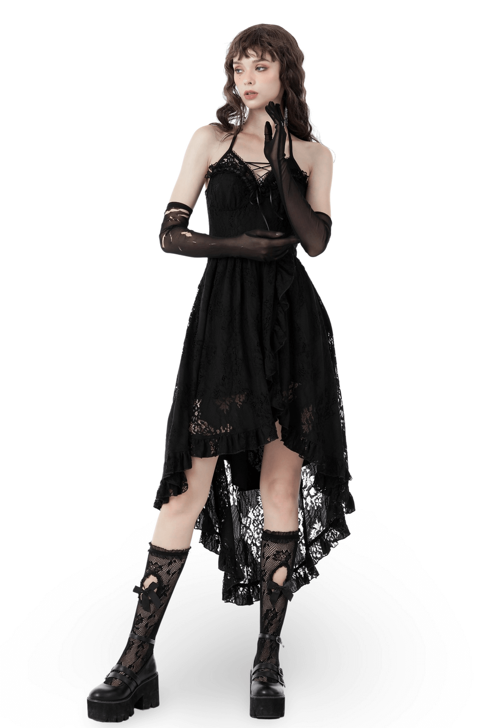 Gothic high-low black lace dress with ruffles, tuxedo bodice, and stylish thigh-high boots.