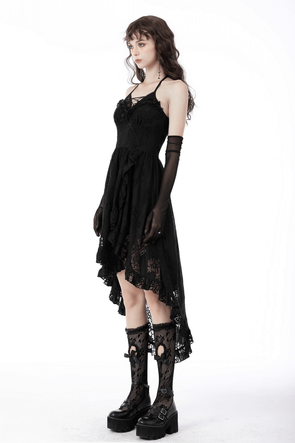 Gothic black lace hi-low dress with ruffle detailing, featuring a tuxedo-inspired bodice and elegant silhouette.