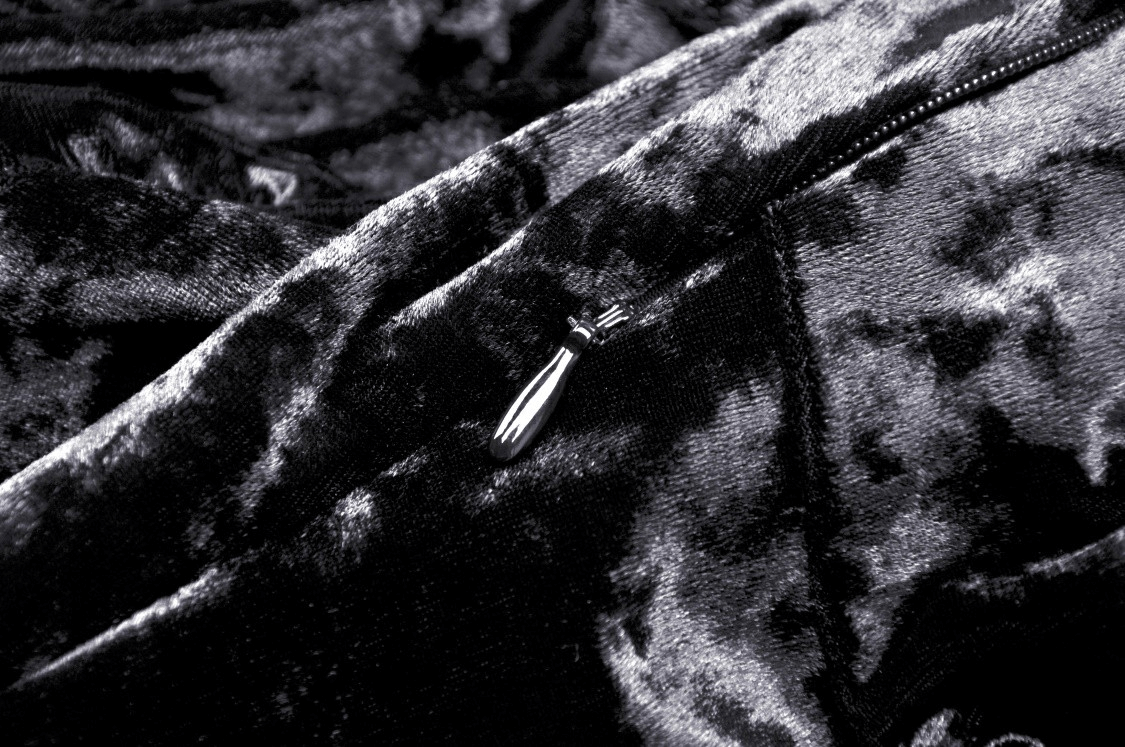 Close-up of the fabric and zipper detail of the Gothic Dramatic Black Velvet Lace Asymmetrical Dress.
