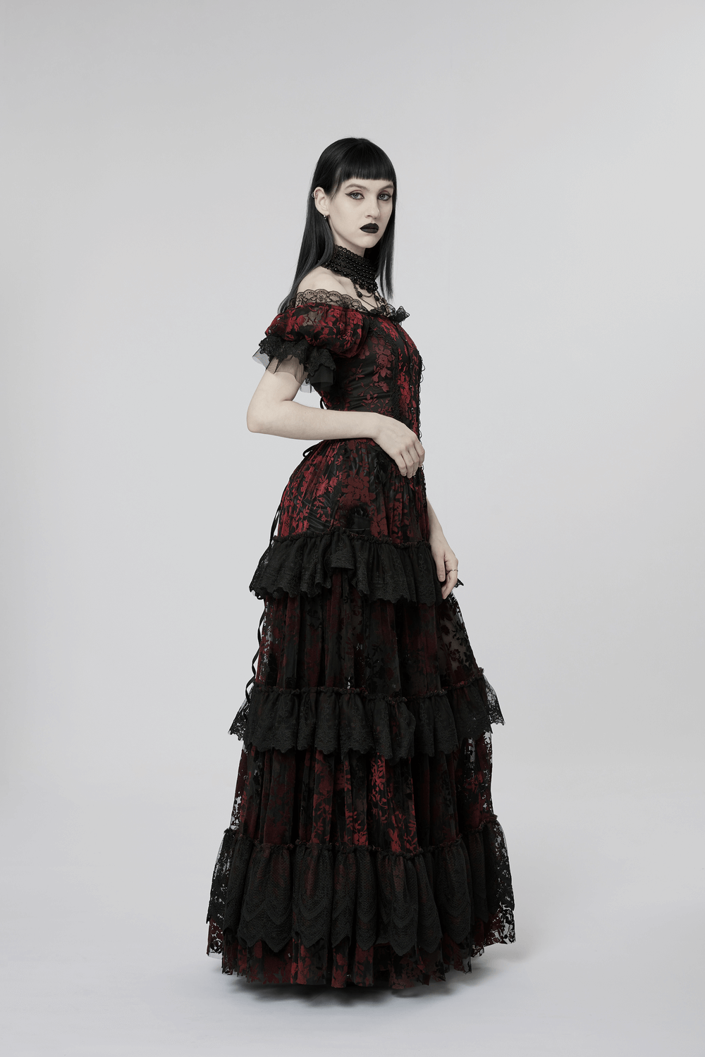 Gothic elegance in a red print gown with flocking details and short sleeves, perfect for a romantic, mysterious look.