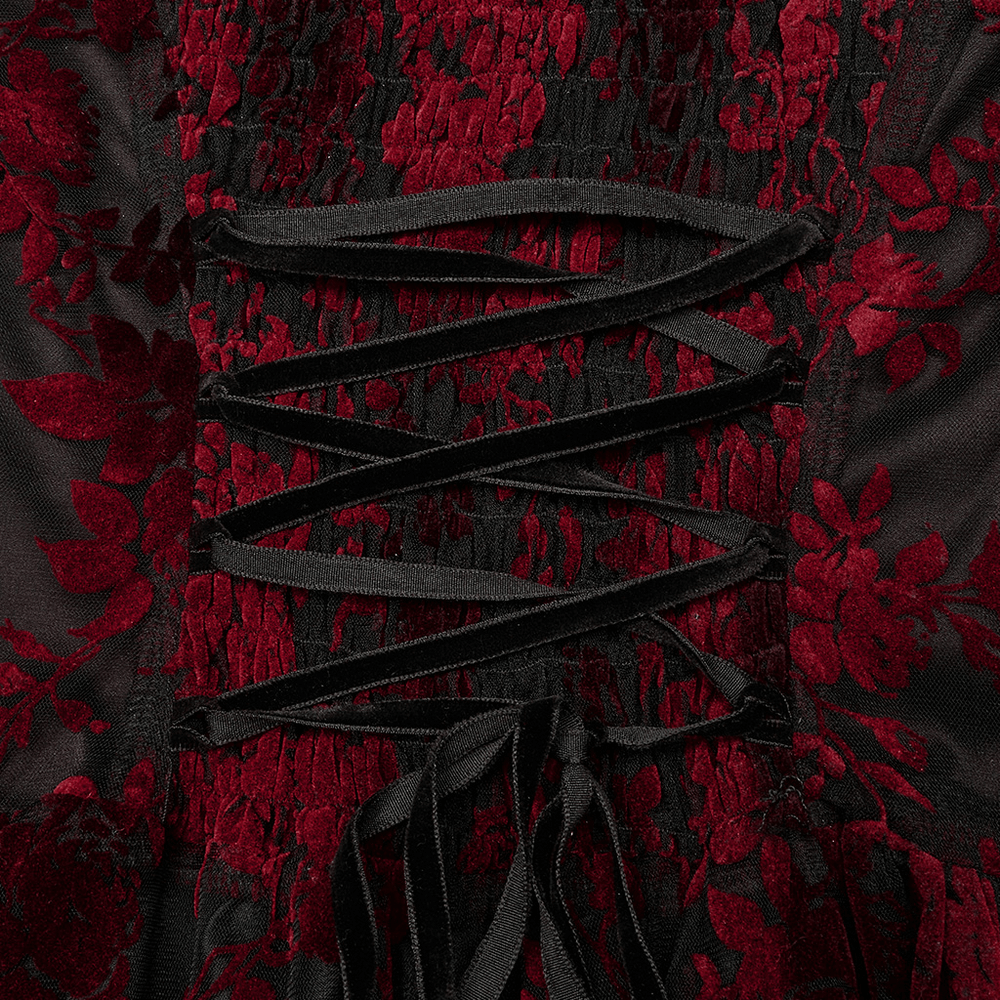 Close-up of gothic red print gown's flocking details and lace-up design, showcasing elegance and allure.