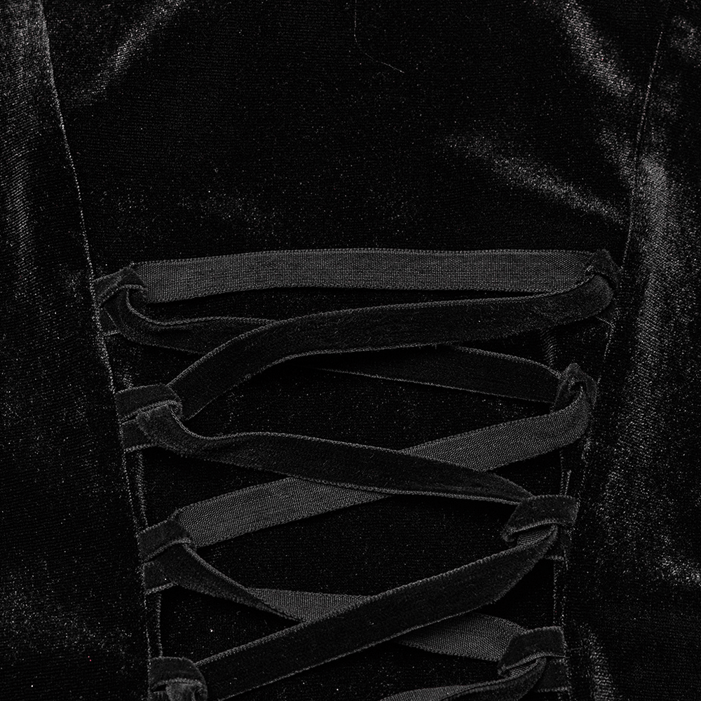 Close-up of elegant black velvet gown showing intricate lace-up detail for a Gothic look.