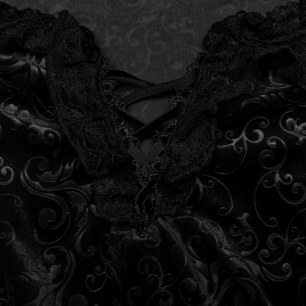 Close-up of the gothic velvet dress V-neck with lace trim and ruffle edges, showcasing intricate embossed pattern.