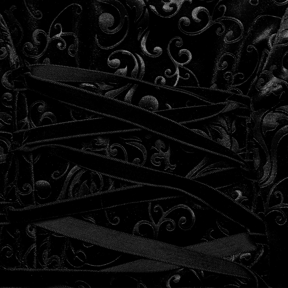 Close-up of embossed black velvet with intricate lace-up detailing, showcasing gothic elegance and mystique.