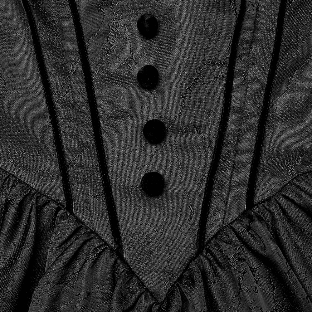 close-up of gothic elegant ball gown showing textured jacquard fabric and decorative black buttons.