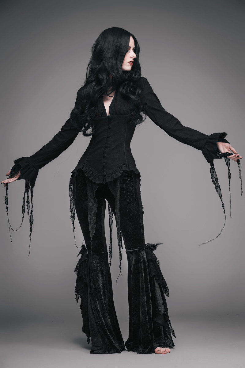 Gothic elegant black deep V blouse for women styled with flowy lace accents and paired with black vintage flared pants.