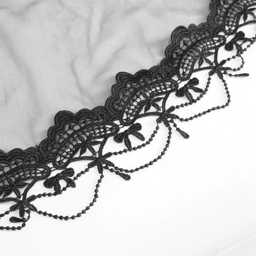 Close-up of a gothic black veil with delicate lace trim, perfect for bridal elegance and vintage-inspired weddings.