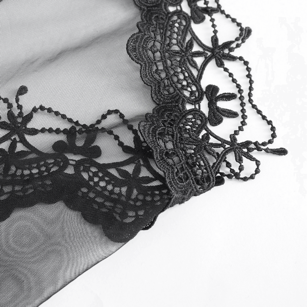 Elegant black lace edge of a gothic veil, showcasing intricate floral designs and soft tulle texture.