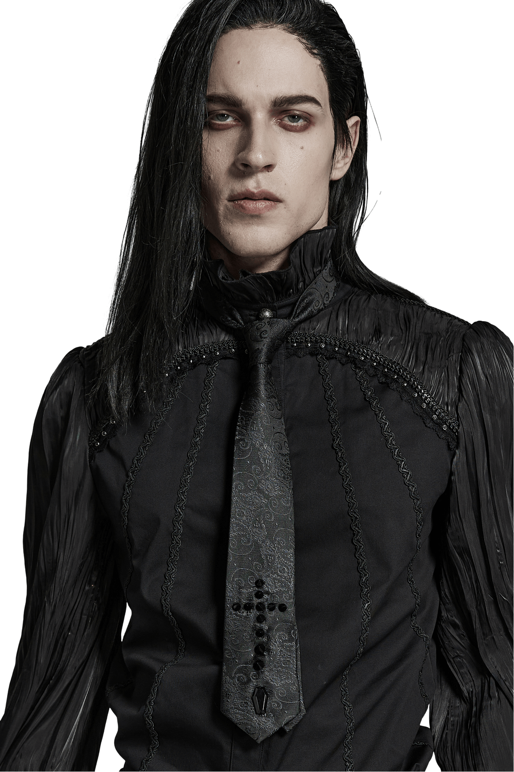 Gothic elegant jacquard cross tie with spikes worn by a model in a stylish black outfit.