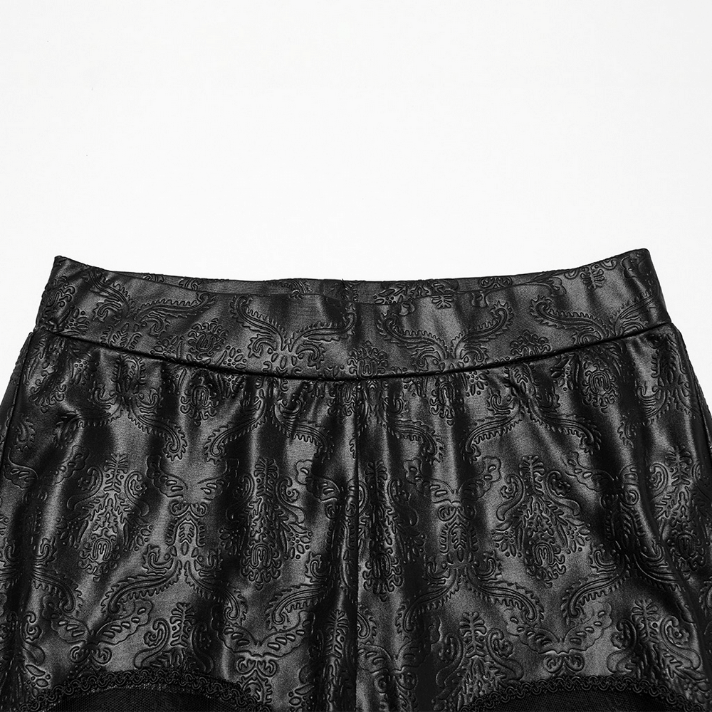 Gothic embossed hollow out leggings showcasing intricate butterfly pattern detail and sleek black rubberized fabric.