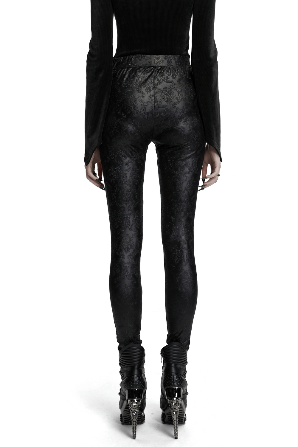 Back view of gothic embossed hollow out leggings with artistic butterfly pattern and vertical drawstrings.