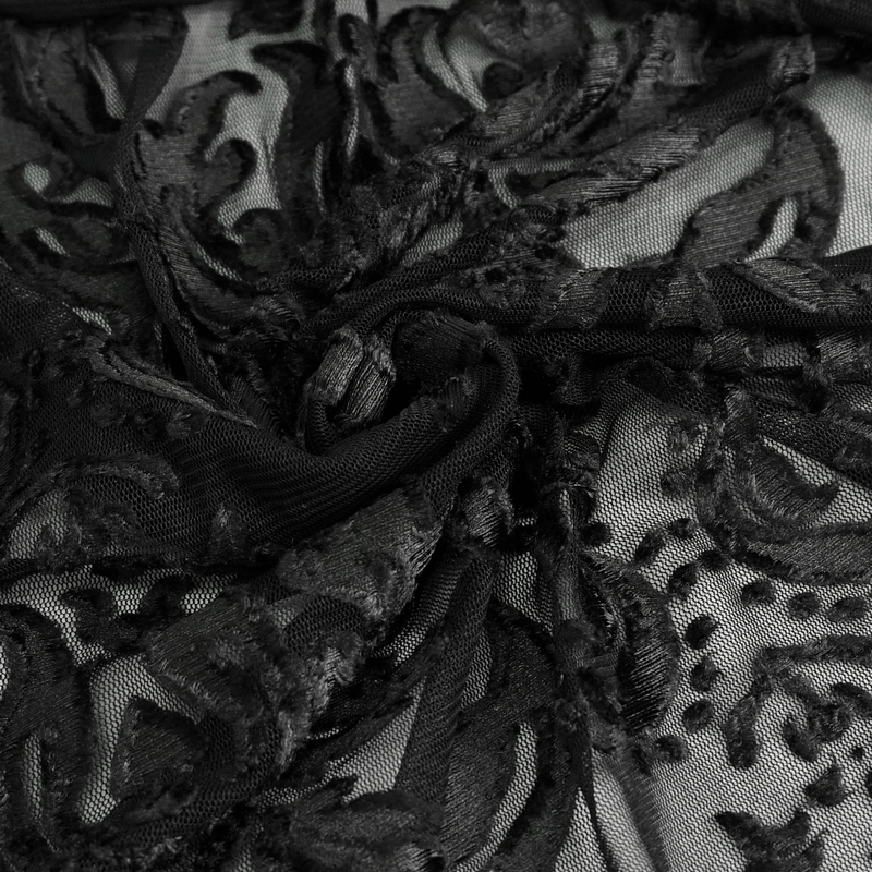 Intricate black lace fabric featuring gothic embroidery in swirling patterns for a luxurious look.