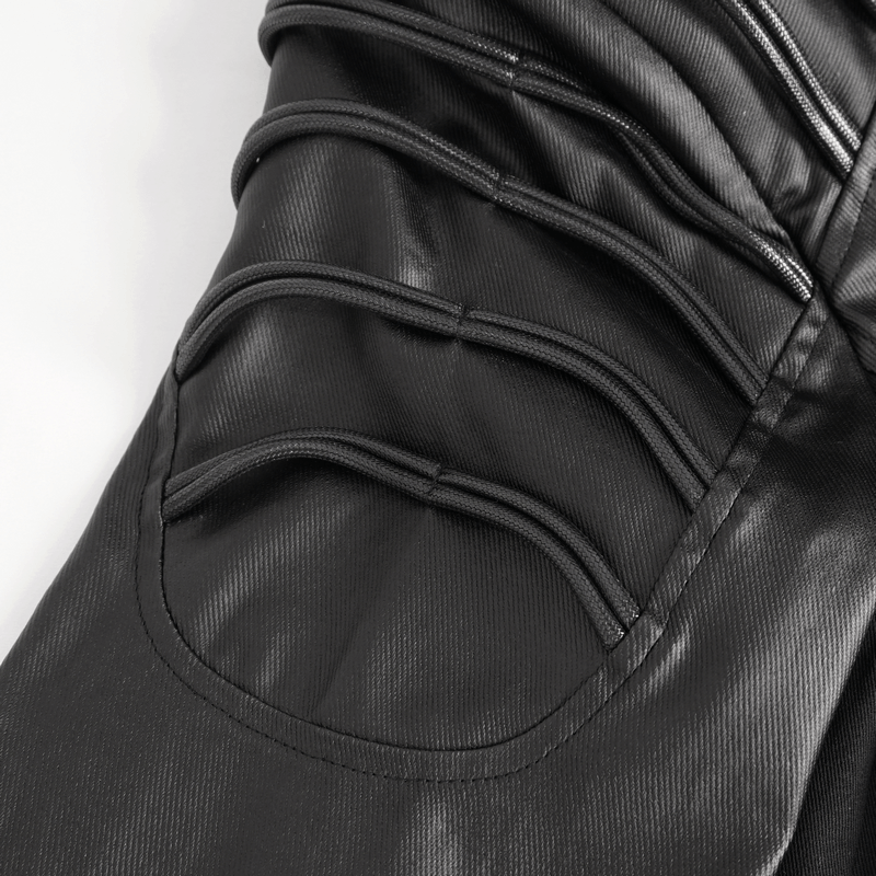 Detail of the gothic black hooded coat showing asymmetrical design and eyelets features.