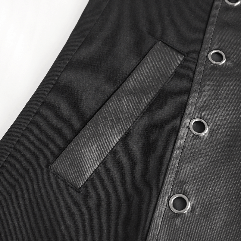 Close-up of gothic black coat detailing with eyelets and sleek pocket design, showcasing modern fashion elements.