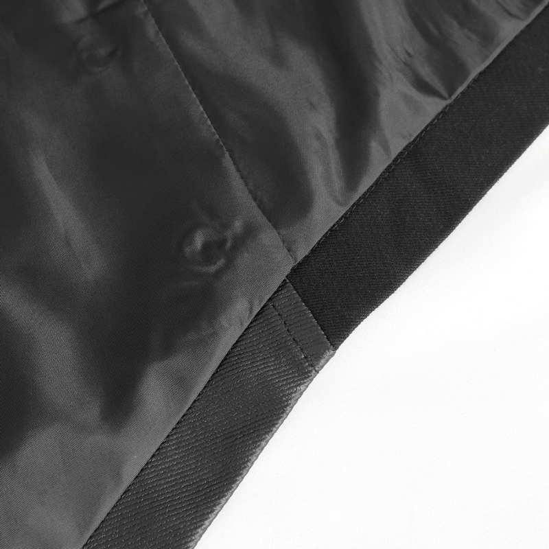 Close-up of the sleek black fabric of a gothic irregular hooded coat showcasing stylish seams and eyelets.