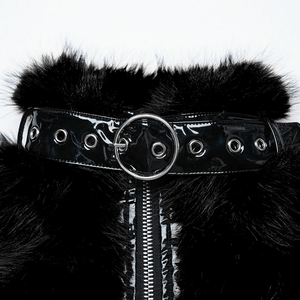 Close-up of a gothic faux fur cropped jacket featuring a glossy patent leather belt with eyelets and a circular buckle.