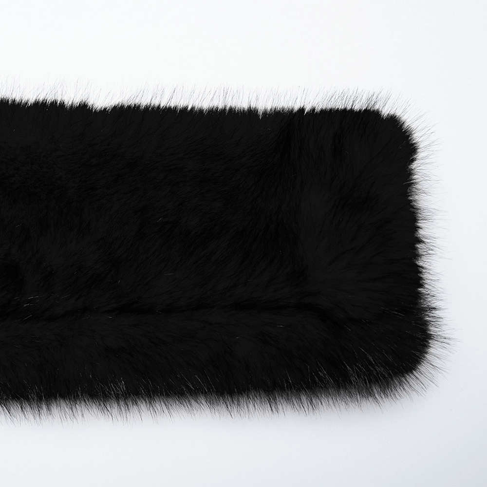 Close-up of luxurious black faux fur, showcasing soft texture and sleek fibers, perfect for edgy fashion styles.