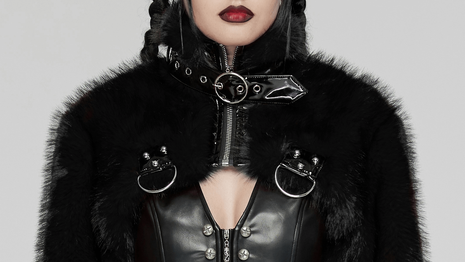 Gothic faux fur cropped jacket with zipper and rivets, showcasing black fur and patent leather details.
