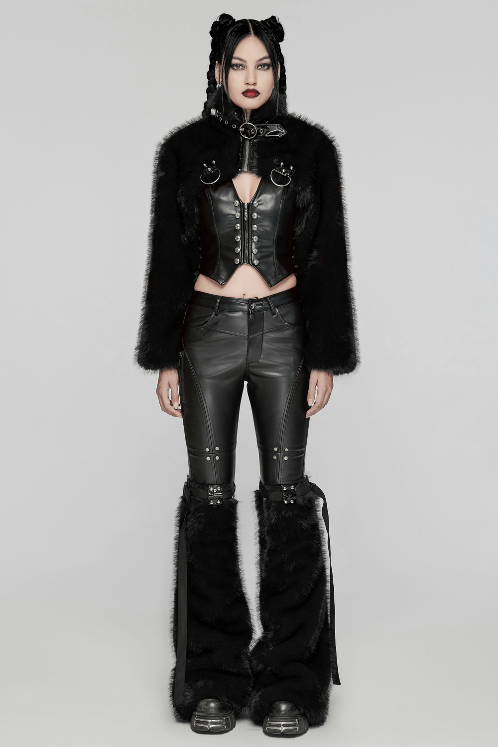 Edgy model in gothic faux fur cropped jacket with patent leather, paired with punk-inspired leather pants.