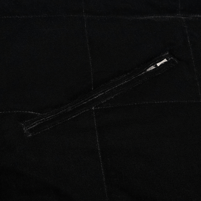 Close-up of the zipper detail on a women's gothic faux fur hooded cape in sleek black fabric.