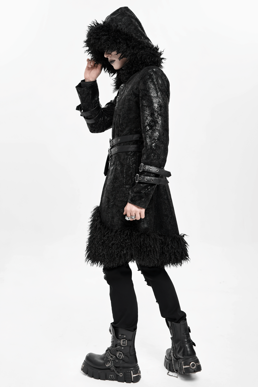Gothic Faux Fur Hooded Trench Coat with Straps and Belts worn by a model, showcasing its dramatic hood and textured finish.