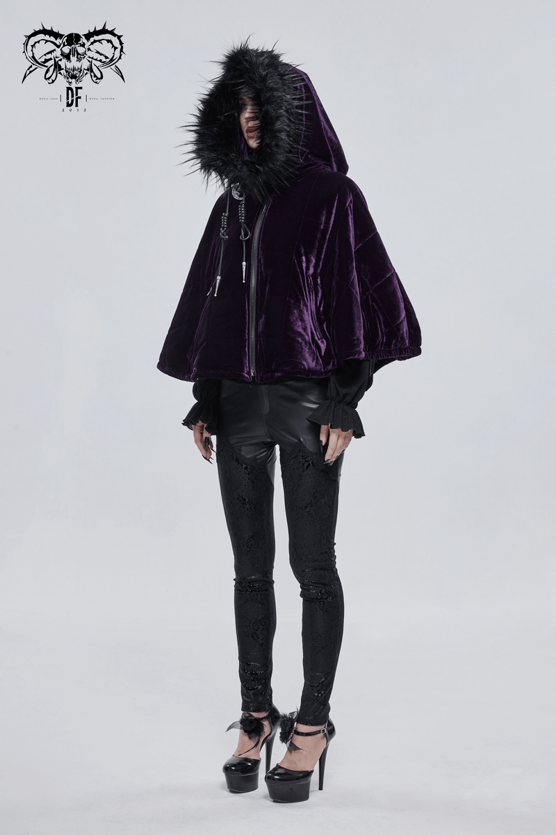 Women modeling a gothic purple velvet cape with fur hood, elegantly paired with black leggings and heels.