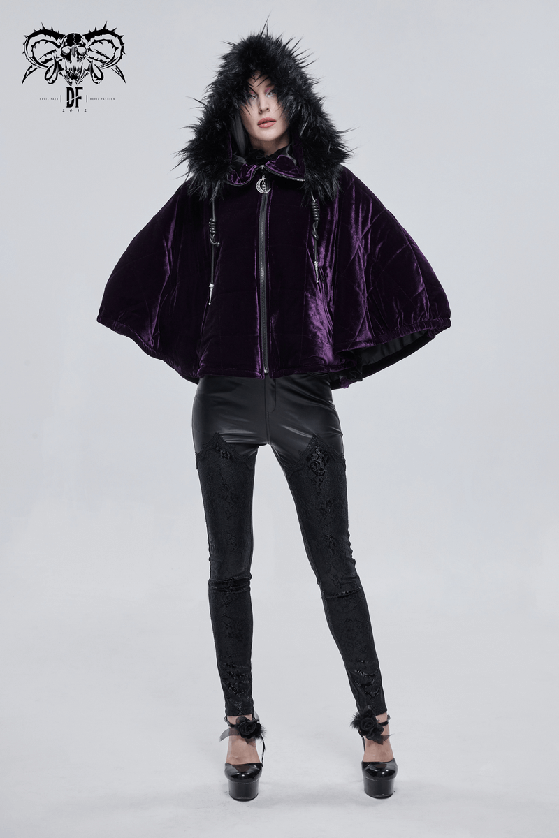 Women in a gothic purple velvet cape with fur hood, styled with black leggings and heels, showcasing elegant gothic fashion.