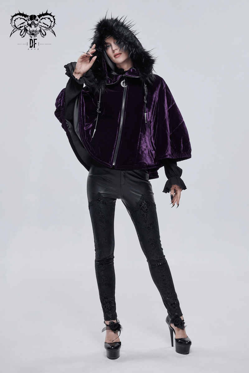 Women wearing a stylish purple velvet cape with a fur hood, paired with black leather pants and heels, exuding gothic elegance.