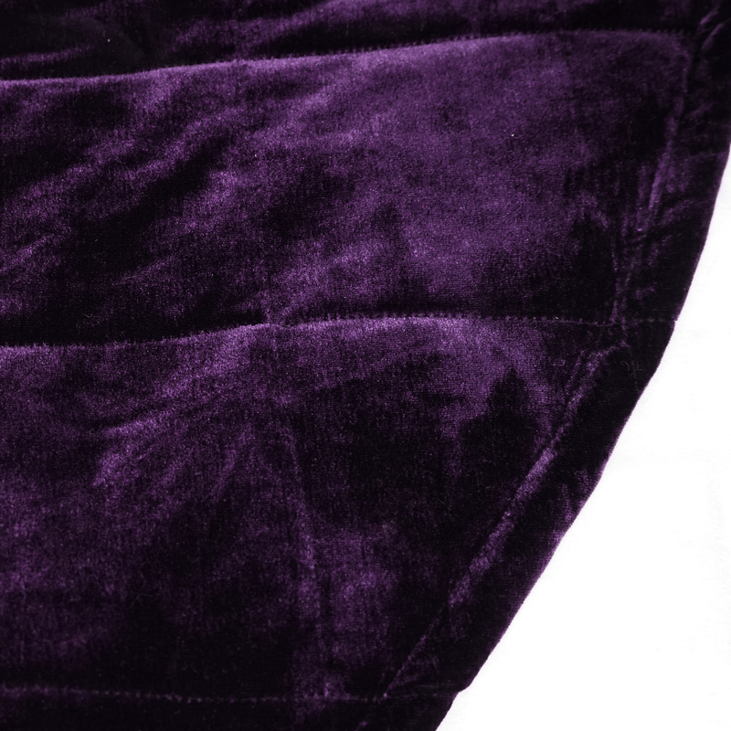 Close-up of luxurious purple velvet fabric of a gothic hooded cape, showcasing its smooth texture and rich color.