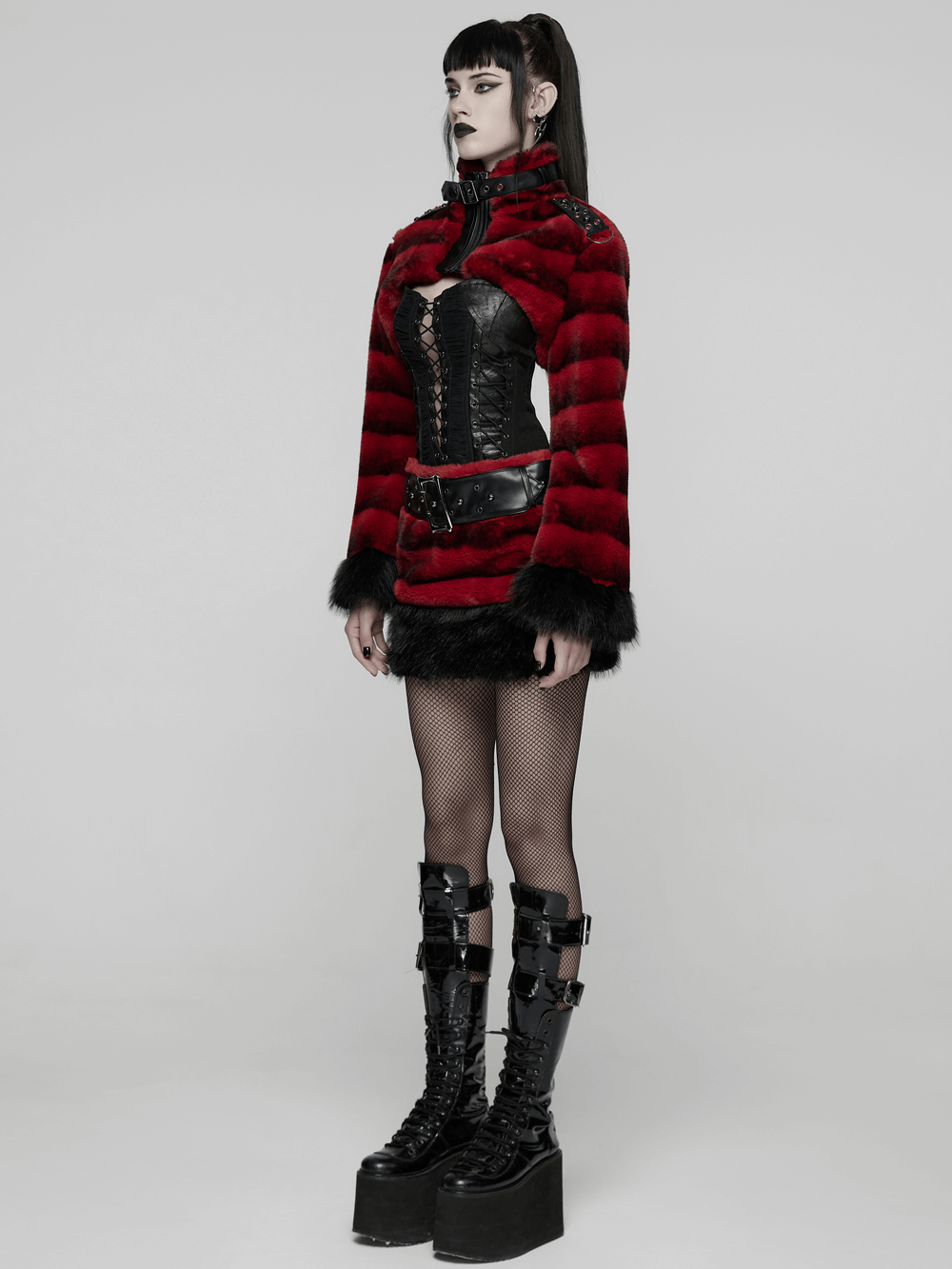 Gothic Faux Fur Mini Skirt with Belt and Studs styled with a red faux fur jacket and chunky platform boots.