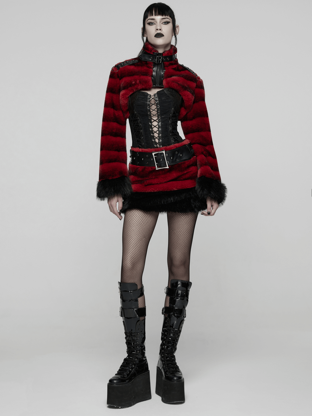 Gothic Faux Fur Mini Skirt with Belt and Studs styled with a punk-inspired outfit, featuring a dramatic texture.