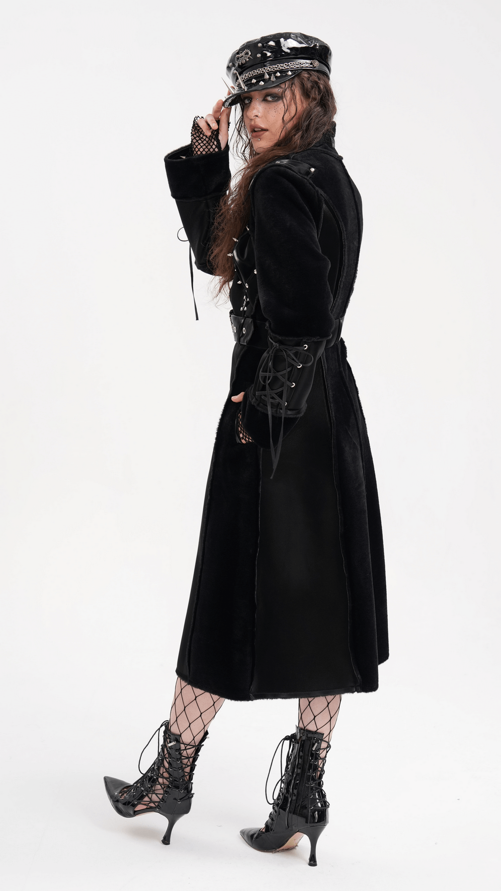 Gothic faux leather and velvet long coat with buckle detail, featuring lace-up sleeves and studded accents, for an edgy silhouette.