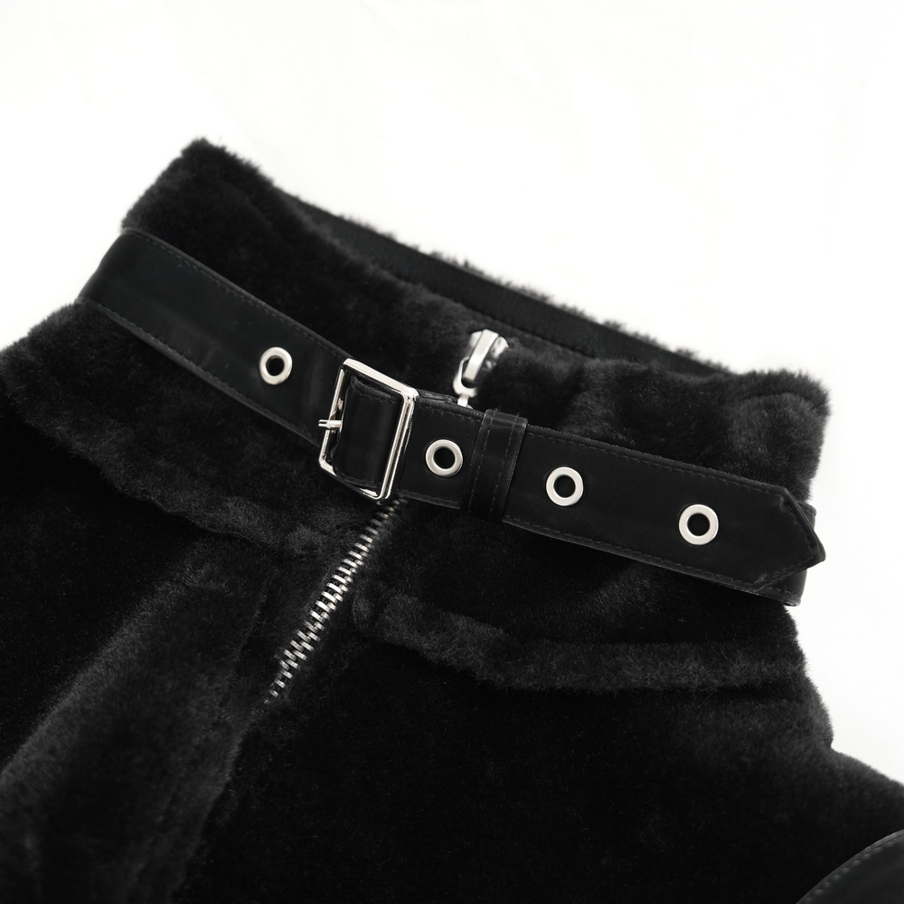 Close-up of the buckle detail and zipper on a gothic faux leather and velvet long coat.