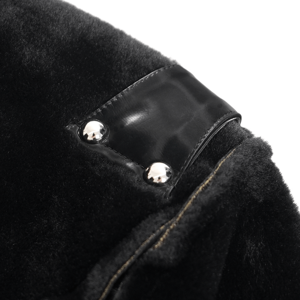 Close-up of Gothic long coat detail showcasing studded faux leather accents and unique texture.