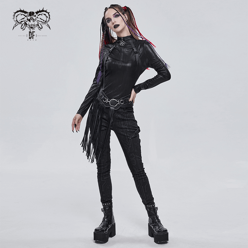 Gothic style model in black faux leather outfit with long tassels and chunky platform boots.