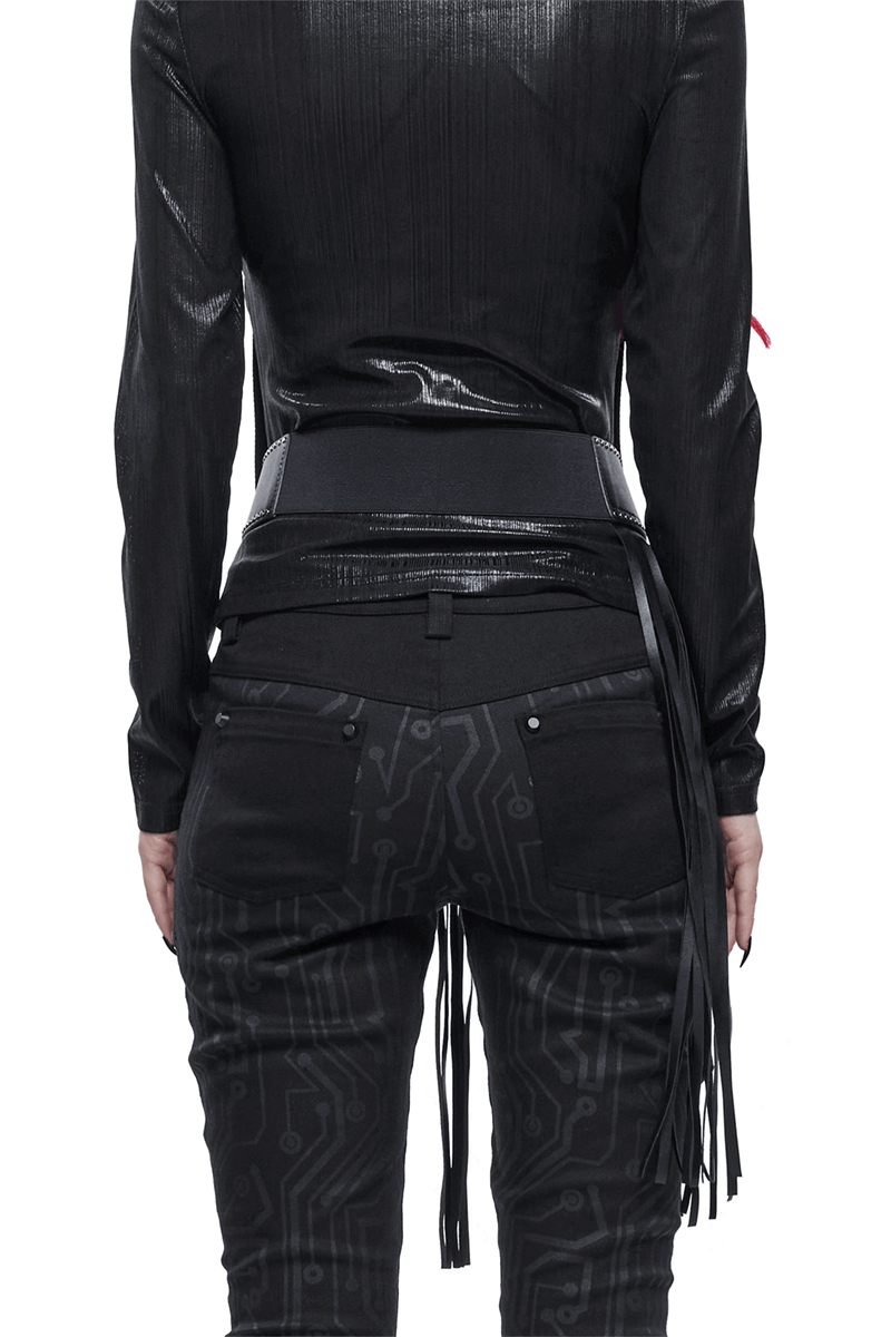 Back view of a woman wearing a black faux leather belt with tassels, paired with stylish black pants featuring a circuit design.