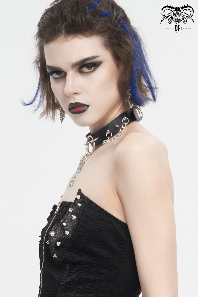 Gothic faux leather choker with studs and metallic details, styled with edgy makeup and dark fashion attire.
