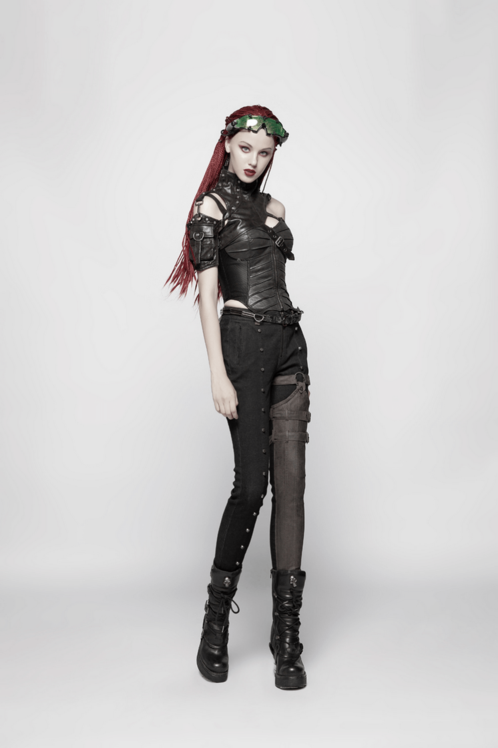 Gothic model wearing a black faux leather corset top and distressed black pants, showcasing a rebellious punk style.