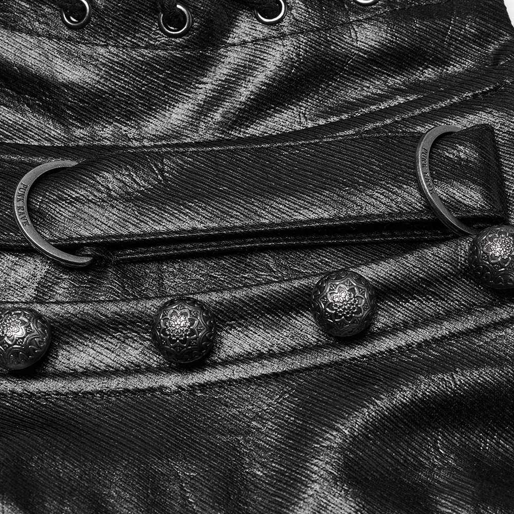 Close-up of gothic faux leather corset detailing with floral buttons and metal D-ring accents.