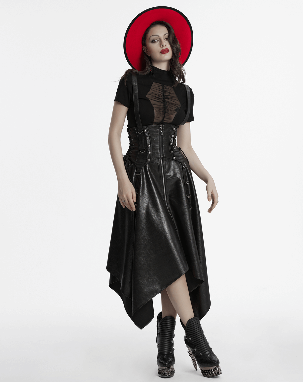 Gothic faux leather corset with straps, paired with a dramatic black skirt and vibrant red hat for punk style.