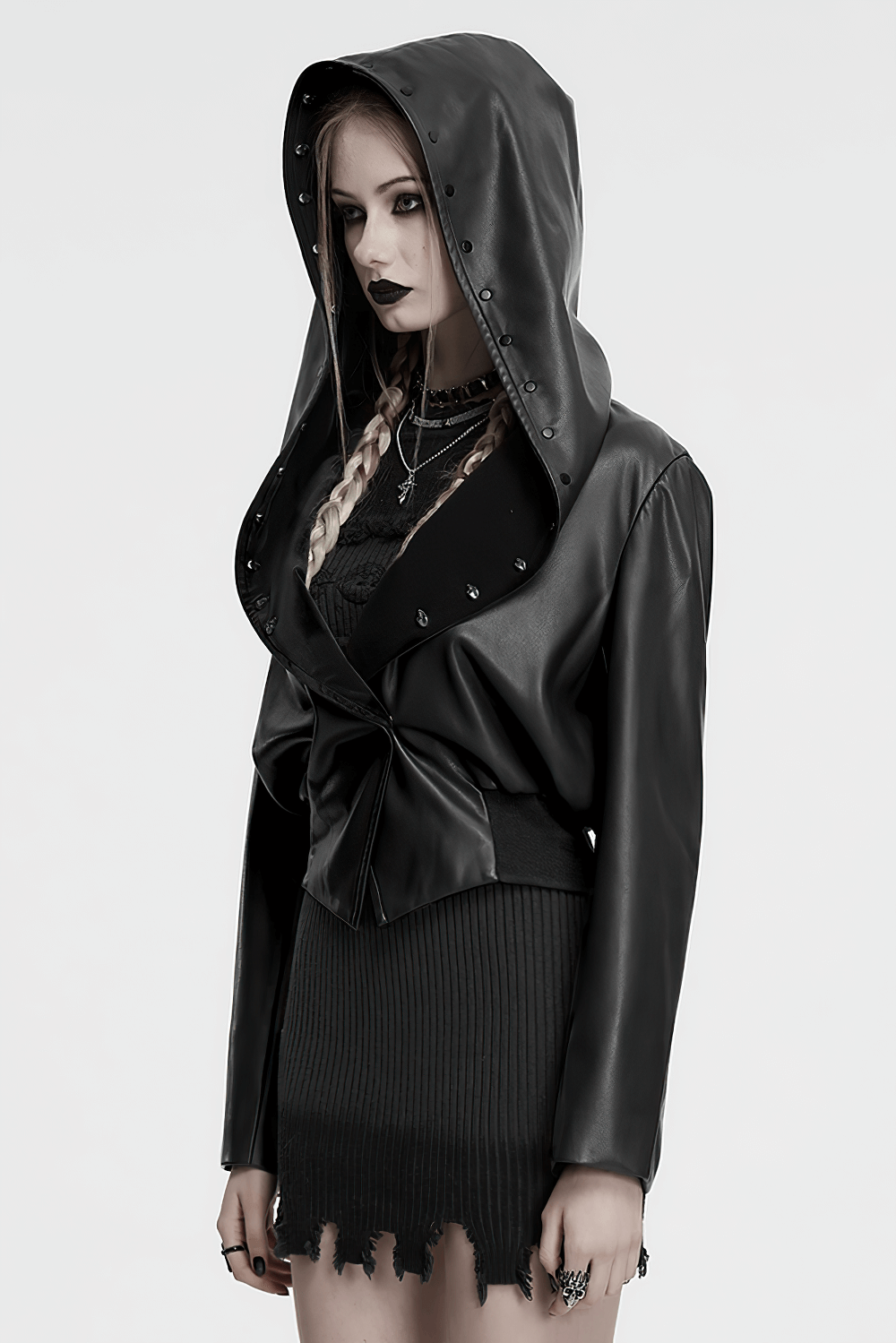 Gothic faux leather jacket with skull-studded brim and oversized hood, perfect for punk streetwear looks.