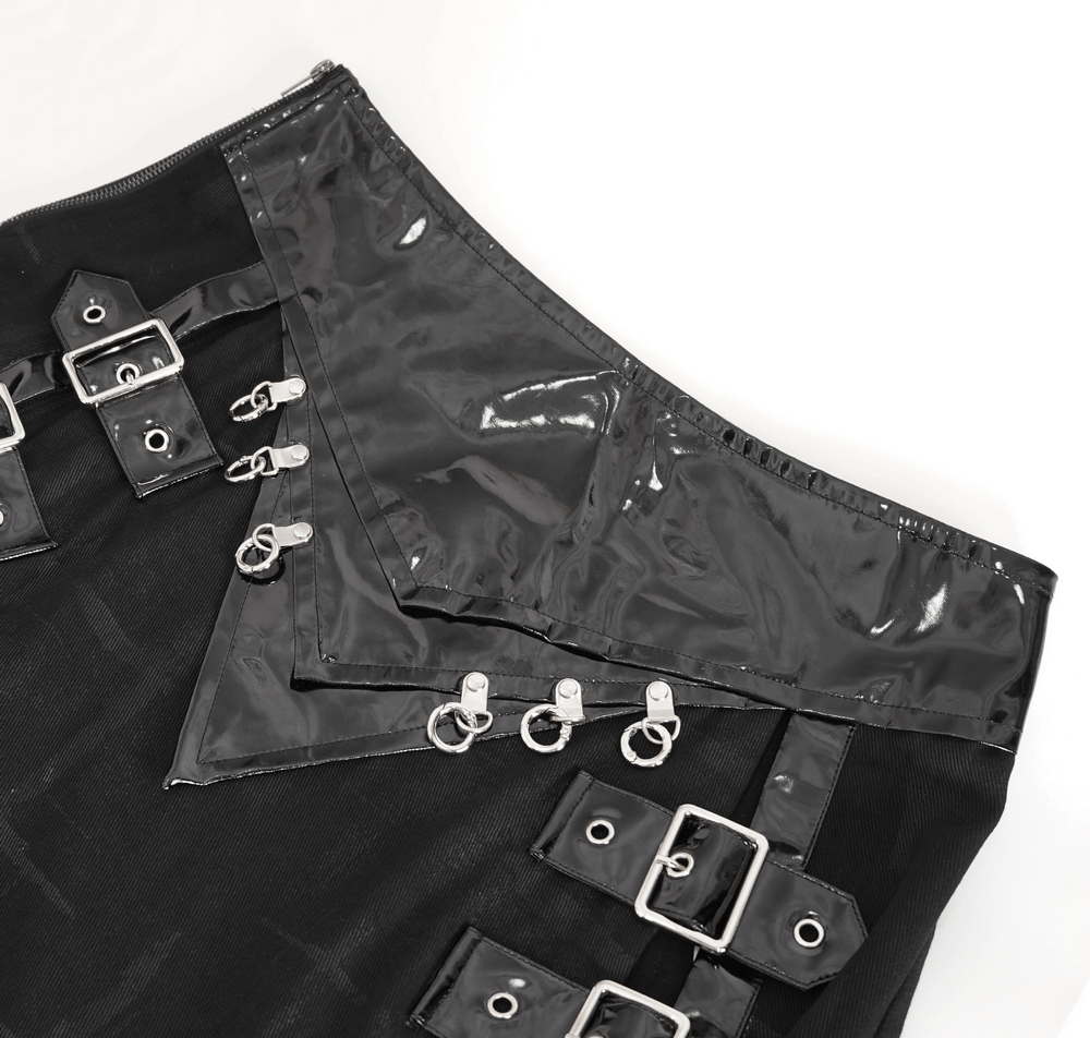 Close-up of Gothic faux leather kilt skirt with chains and buckles, showcasing edgy design details.