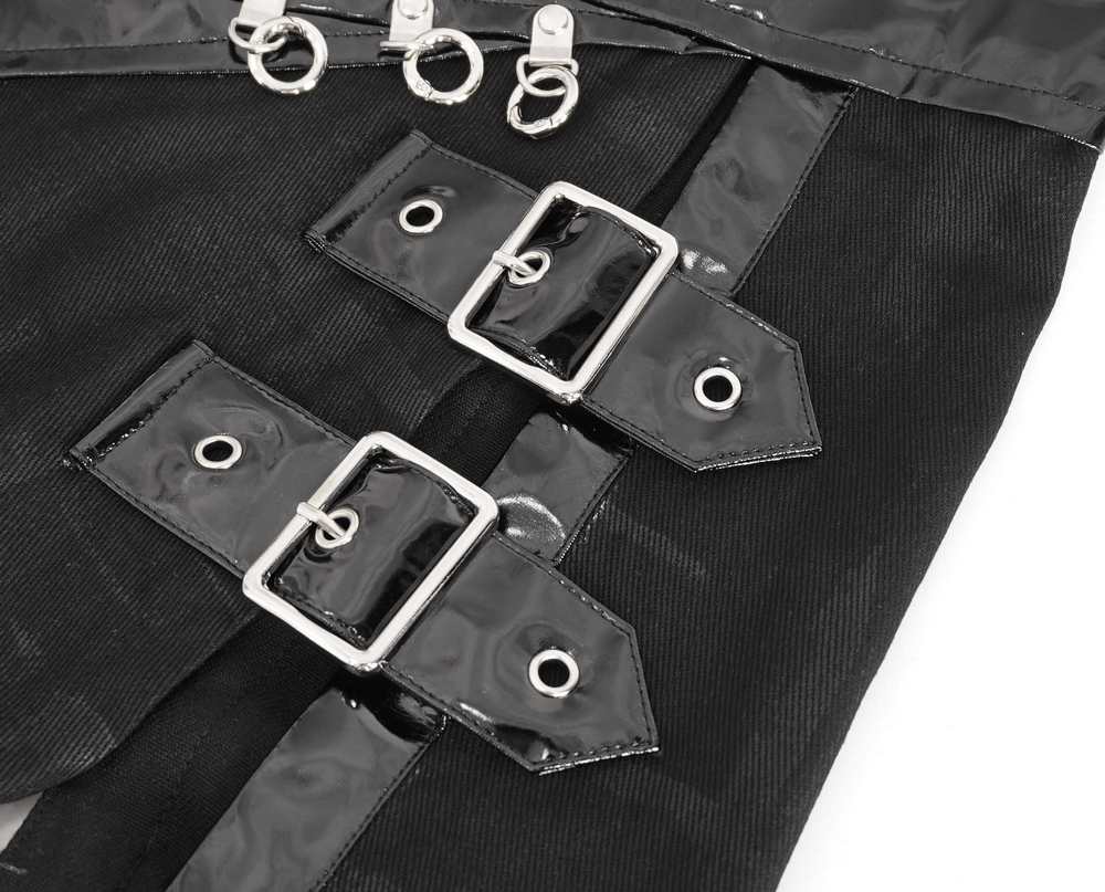 Close-up of gothic faux leather kilt skirt detailing featuring shiny chains and buckles for a rebellious style.