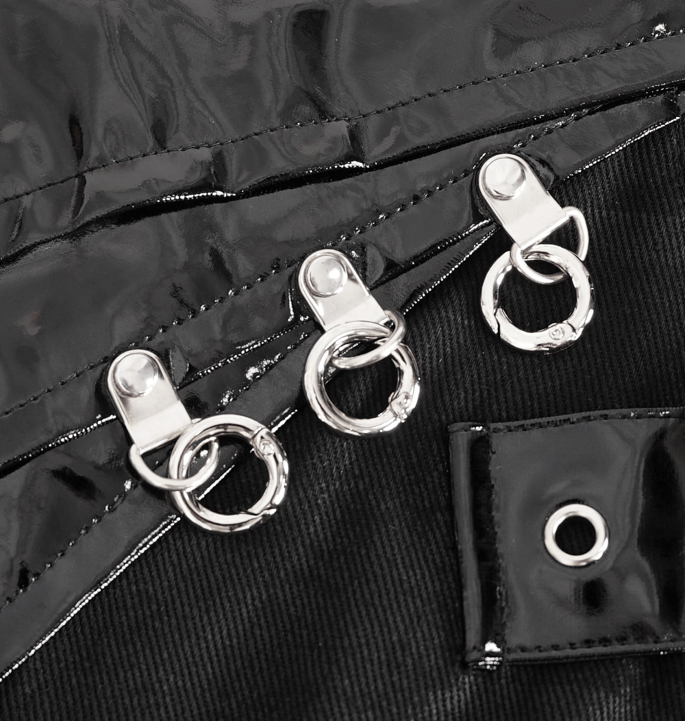 Close-up of chains and buckles detailing on Gothic faux leather kilt skirt by Midnight Rebel.