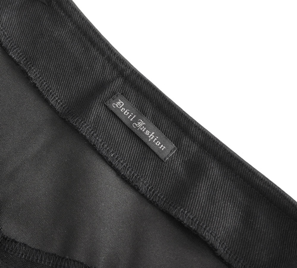 Detail close-up of the 'Devil Fashion' label on a black garment, representing gothic style and premium quality.